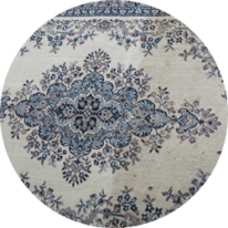 Closeup of floral patterned rug, showing before and after cleaning